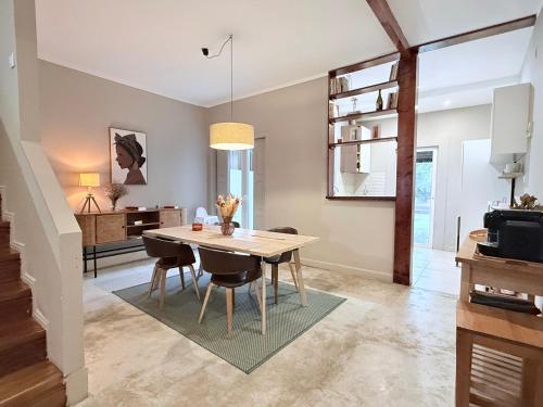 a kitchen and dining room with a table and chairs at Porto Vintage House in Porto