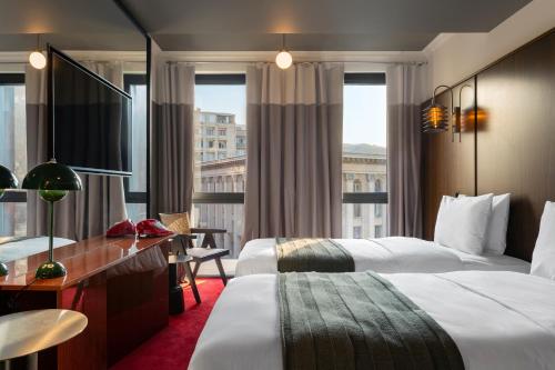 Postel nebo postele na pokoji v ubytování Hotel Afisha