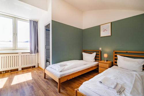 Katil atau katil-katil dalam bilik di StayInn Hostel und Gästehaus