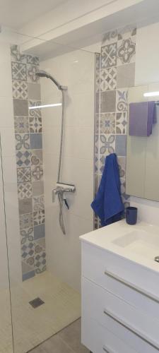 a bathroom with a shower with a glass door at Cozy loft with Stunning Sea View in Palm-Mar