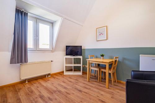 Televisyen dan/atau pusat hiburan di StayInn Hostel und Gästehaus