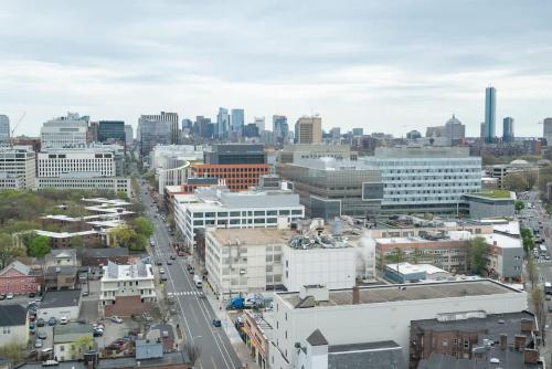an aerial view of a city with buildings at Central Serene Penthouse w King bed GYM Parking in Cambridge