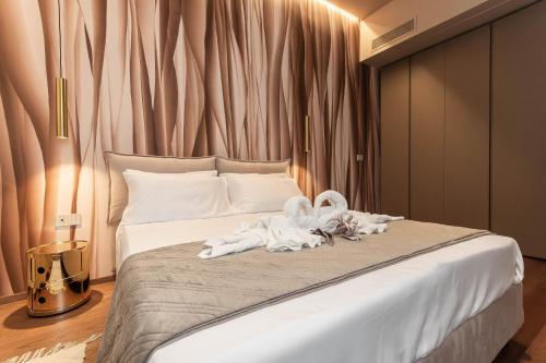 Postel nebo postele na pokoji v ubytování Carignano luxury suite