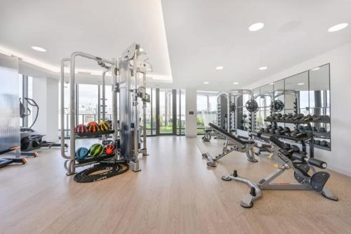 a gym with treadmills and elliptical machines at Central Serene Condo King Bed by MIT Harvard GYM in Cambridge