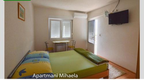 Postel nebo postele na pokoji v ubytování Mihaela Beach Apartments