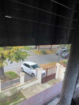 a white car parked in a parking lot at Zemunski mir in Zemun