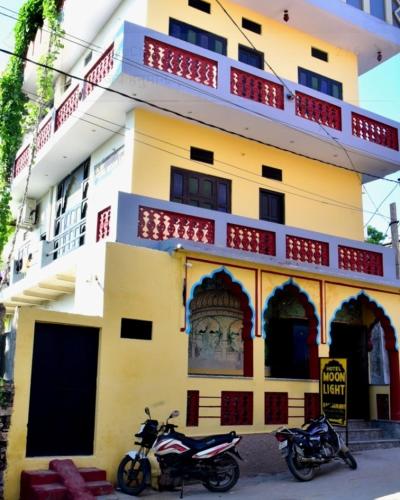 two motorcycles parked in front of a building at Hotel Moon Light in Pushkar
