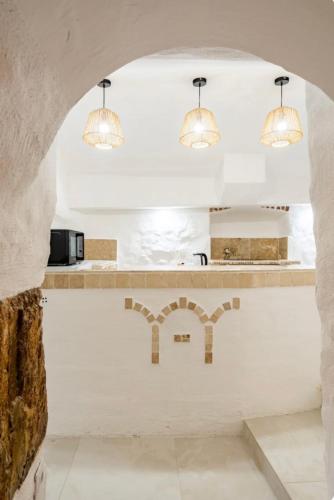 Dapur atau dapur kecil di Le temple d'Aphrodite, Appartement avec SPA