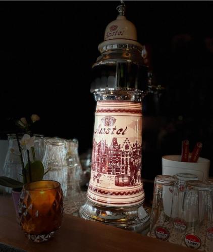 a bottle of alcohol sitting on top of a table at HCR de Zwaan in Kapelle