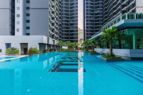 a large swimming pool in a city with tall buildings at Modern #CityView Majestic Maxim Near UCSI, KL, MRT in Cheras