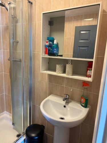 a bathroom with a sink and a shower at WoolPack in Huddersfield