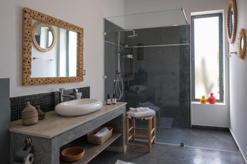 a bathroom with a sink and a shower at Villa Netumia in Marrakesh