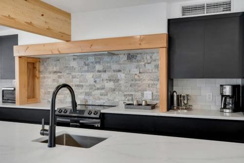 a kitchen with a sink and a counter top at Oro Valley Lux Stay in Tucson