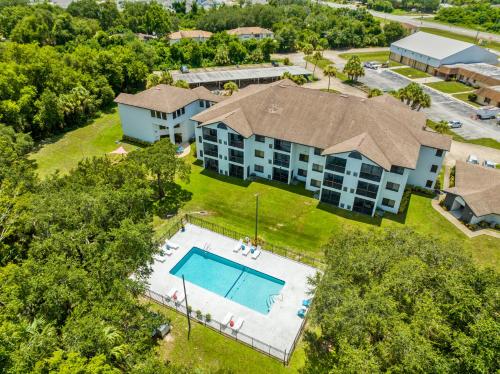 an aerial view of a hotel with a swimming pool at Oasis 219 - Amalfi Allure in Titusville