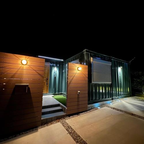 a house with two doors at night at Hoshizora Terrace Minamiizu - Vacation STAY 08878v in Minamiizu