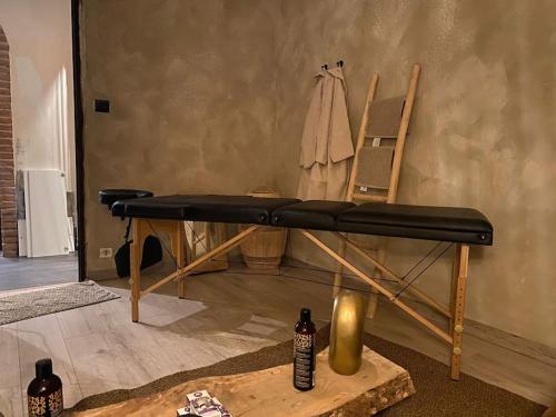 a bed in a room next to a wall at Luxury Relax Idromassaggio in Meana di Susa