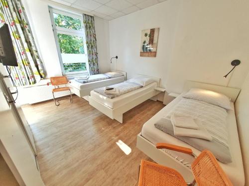 a hospital room with a bed and a couch at Aparthotel B & L in Bremen