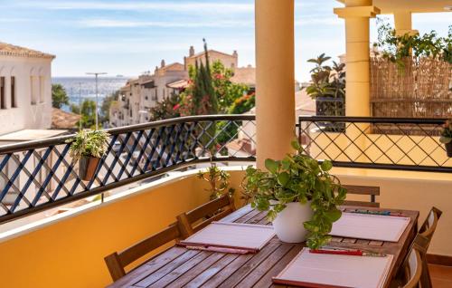 two tables on a balcony with a view at Nice Apartment In Aguadulce With Wifi in Aguadulce