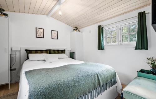 a bedroom with a bed and a window at 3 Bedroom Cozy Home In Ulfborg in Ulfborg