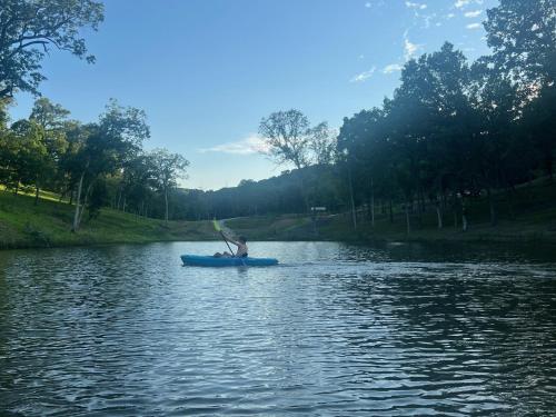 a person in a kayak on a river at Cozy Cabin Retreat for Your Perfect Getaway in Imperial