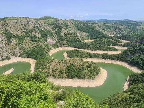 an aerial view of two lakes in the mountains at Markove kolibe 5, Uvac, Sjenica in Sjenica