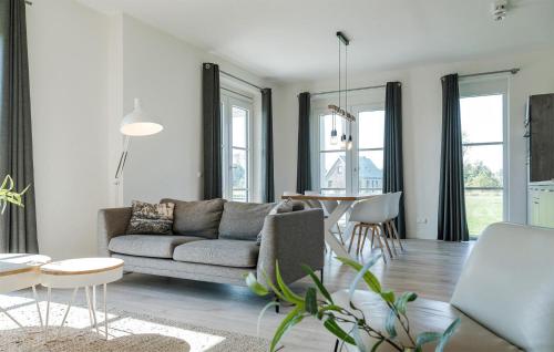 a living room with a couch and a table at Cozy Apartment In Kamperland With Wifi in Kamperland