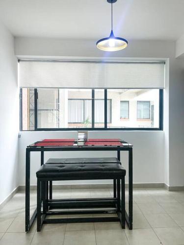 a room with a table in front of a window at Depto Av Granjas Azcapotzalco in Mexico City