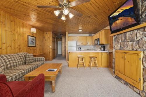 a living room with a couch and a table at The Lodges at Breezy Point in Breezy Point