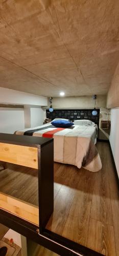 Postel nebo postele na pokoji v ubytování Aparta estudio Bogota zona exclusiva al norte