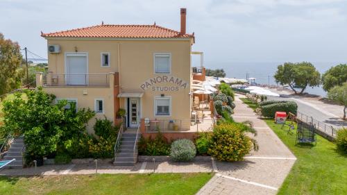 a villa with a view of the ocean at Palaiologou Panorama Apartments in Mantamádos