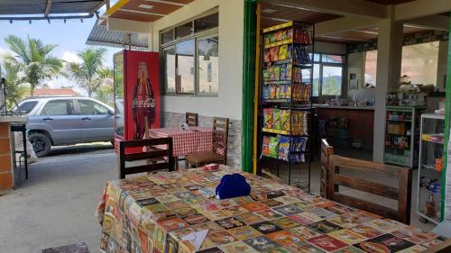 a shop with a table and a table and a table sidx sidx at Hospedaje rural y restaurante in Santa Rosa de Cabal