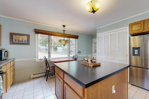 a kitchen with a large island in the middle at Waterfront Oasis in Trenton
