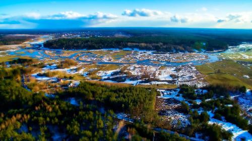 an aerial view of a city with snow and trees at Domek Leśny Cud koło Supraśla - Cisza i Spokój in Studzianki