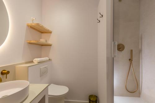 a bathroom with a sink and a toilet and a shower at Mediterranean Loft in Alicante