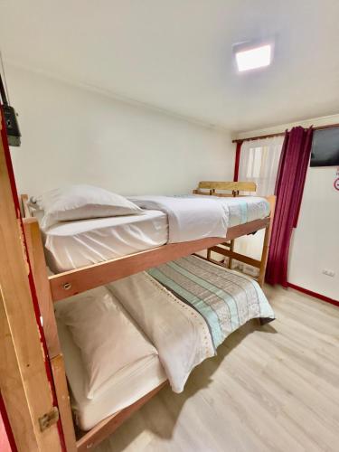 Katil atau katil-katil dalam bilik di Hostal Brisas del Sur