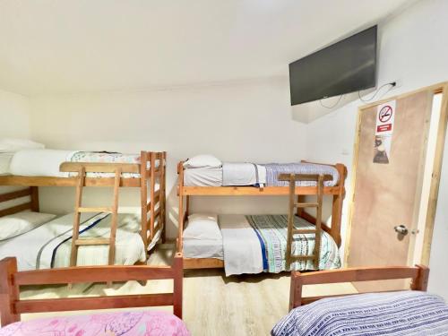 Katil atau katil-katil dalam bilik di Hostal Brisas del Sur