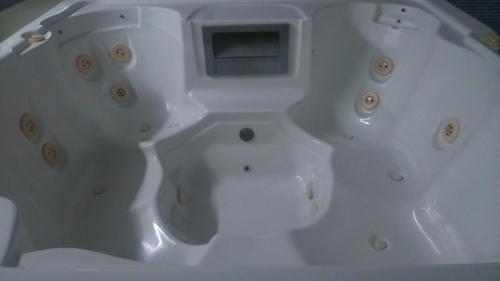 a white bathtub with a drain in the middle at Mar Cantabrico Apartment in Gijón