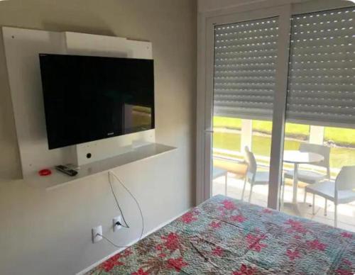 TV a/nebo společenská místnost v ubytování Verão Inesquecível no Condomínio Rossi