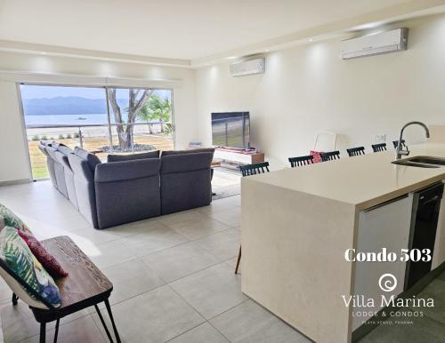 a kitchen and living room with a view of the ocean at Villa Marina Lodge & Condos in Playa Venao