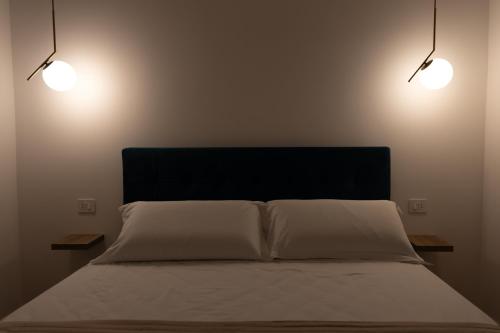 Postel nebo postele na pokoji v ubytování Dimora Diaz B&B