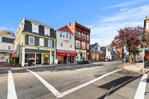 an empty street in a town with a stop sign at Downtown Beverly Apartment 8 Minutes to Salem and has King Beds in Beverly