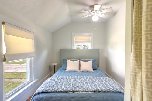 a bedroom with a bed with a ceiling fan at Vermilion Home - Walk to Main Street Beach! in Vermilion