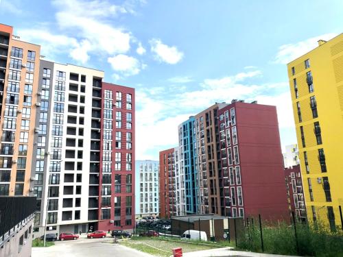 a group of tall buildings in a city at OSapart hotel in a complex Semycvit 8 in Lviv