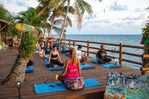 a group of people in a yoga class on the beach at Monasterio del Viento in Bahia Maracaibo