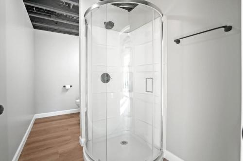 a shower in a bathroom with a glass shower stall at Buck Run - a secluded cabin in Rockbridge, OH in Rockbridge