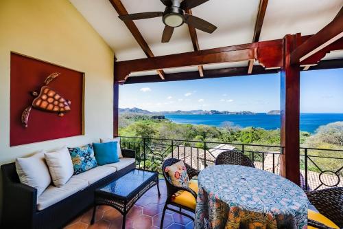 a living room with a couch and a table at Private Villa, Infinity Pool, 2 Quiet Beaches in Potrero