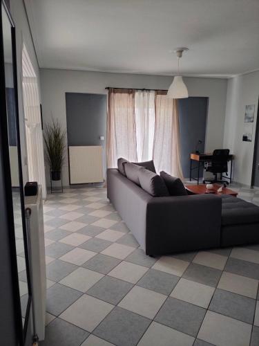 a living room with a couch and a table at Makis 2 in Igoumenitsa