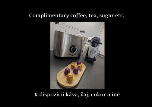 a counter top with a coffee maker and a microwave at E3 Luxury OldTown Apt w Free Garage, Supermarket, FastWifi, Unlimited Music, Prime Video, Aircon in Košice
