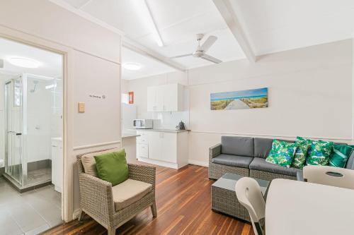 a living room with a couch and a table at Tondio Terrace Flat 5 - Pet Friendly in Gold Coast