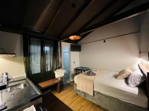 Postel nebo postele na pokoji v ubytování Loft 202 em frente à Vila Germânica Oktoberfest- Villa Haus